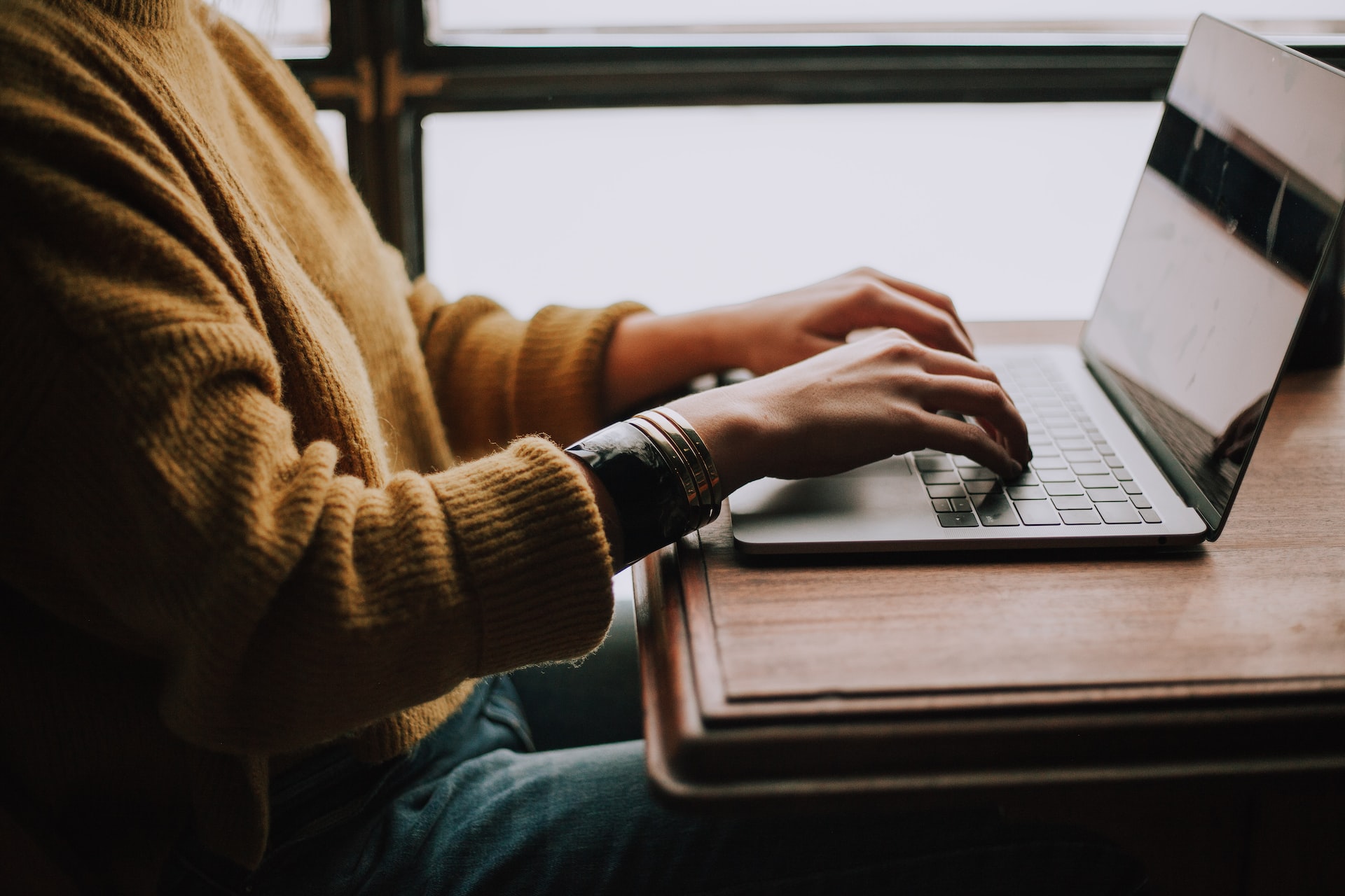 Woman working on a computer organizing next-year planning. 