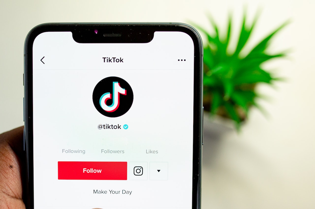 Phone with TikTok showing on the screen.