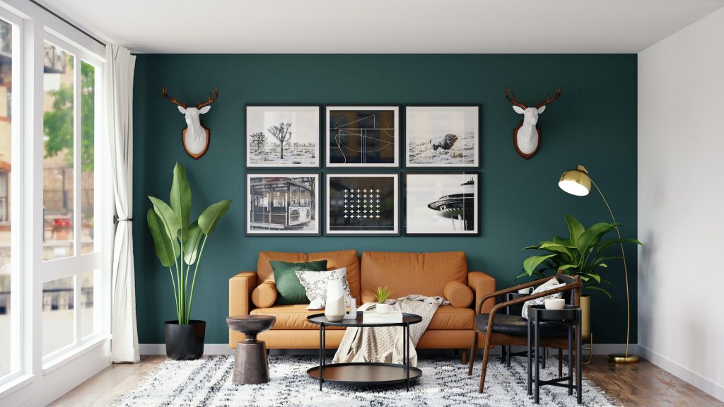Home decor influencers can give you design inspiration like this living room with a dark green wall and leather couch.