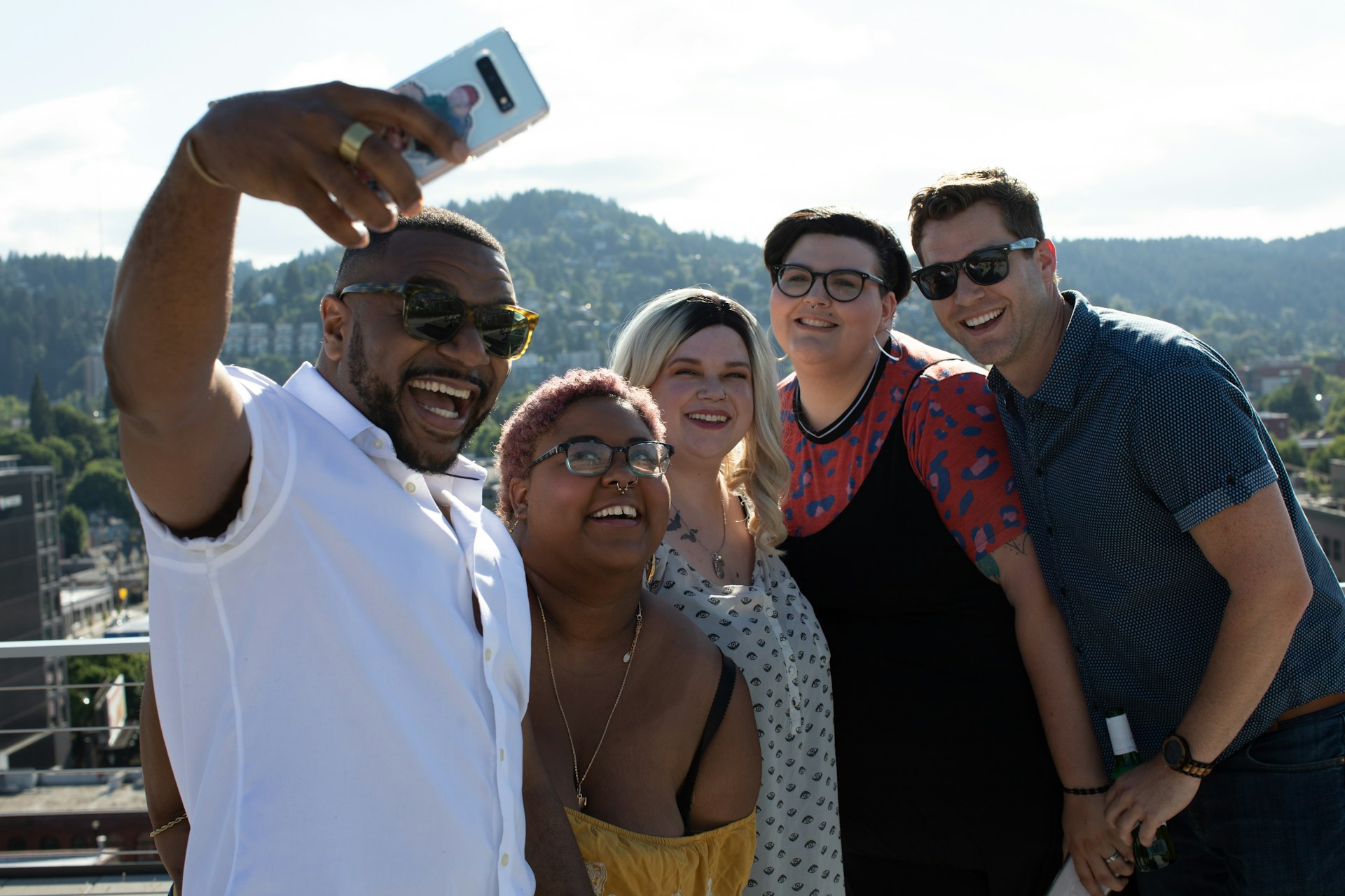 Influencers taking a photo on a roof top.